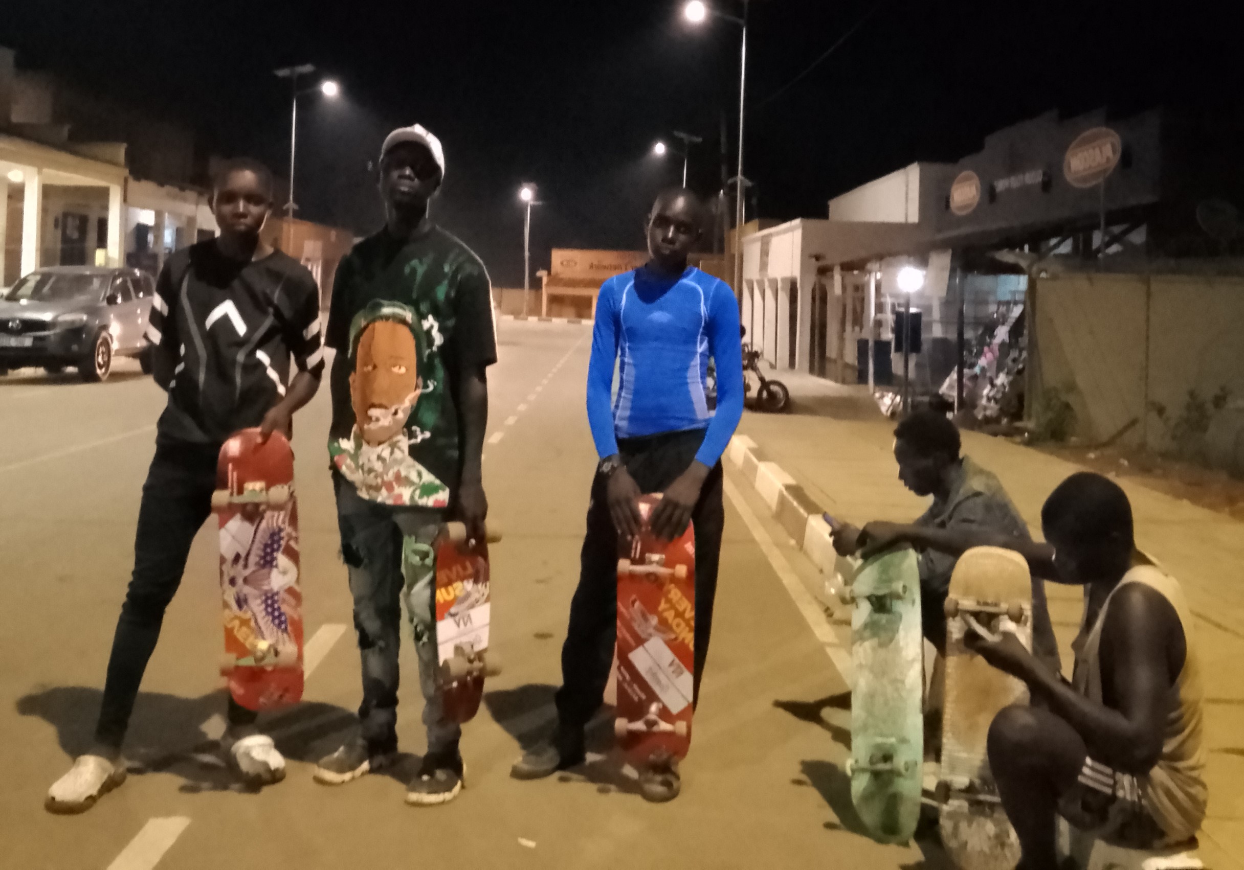 KiSS Skateboard members skating at Stanbic Street